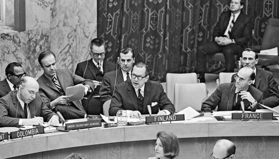 Officials at a meeting table.