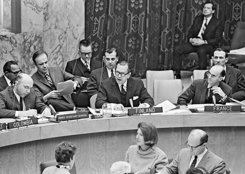 Officials at a meeting table.