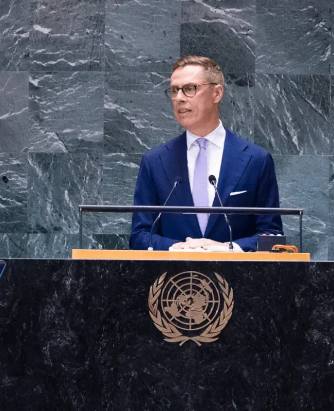 President Alexander Stubb standing behind a podium and addressing the United Nations General Assembly.