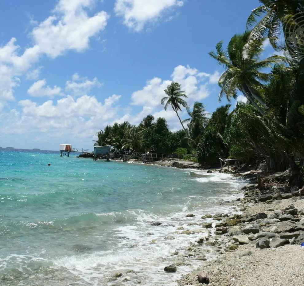 Nukunonu Atoll seaside. Palms, sand, sea.